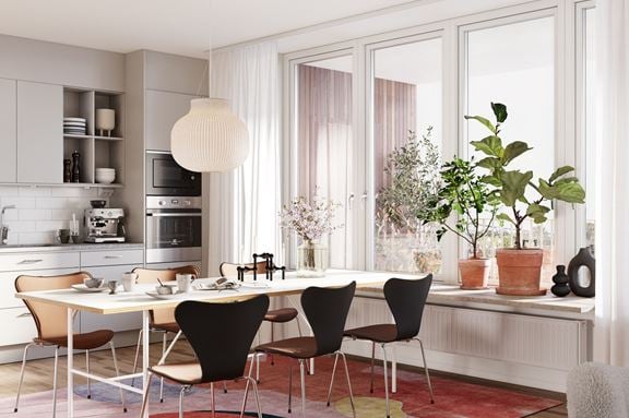 Vy över vardagsrum och kök med fin inredning